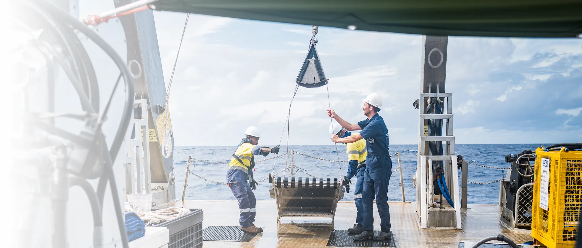 Wassoc engineers and ship crew recovering subsea magnet sled onto back deck