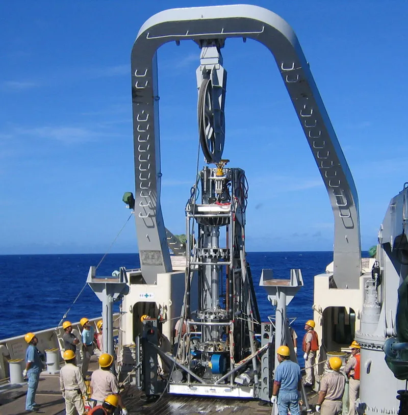 Original BMS seafloor lander drill on back deck of ship with rotational tool handling and landing feet for hard seafloor sediment